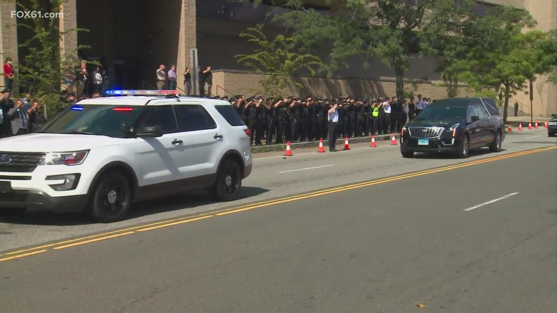 Procession goes by police headquarters