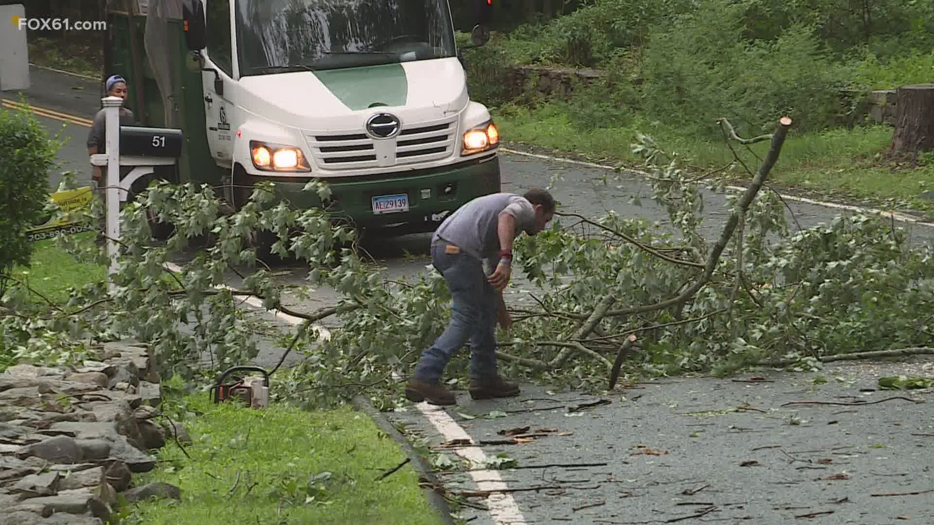 The crew pulled out a chainsaw and cut off enough of the large limb so that traffic could get through.