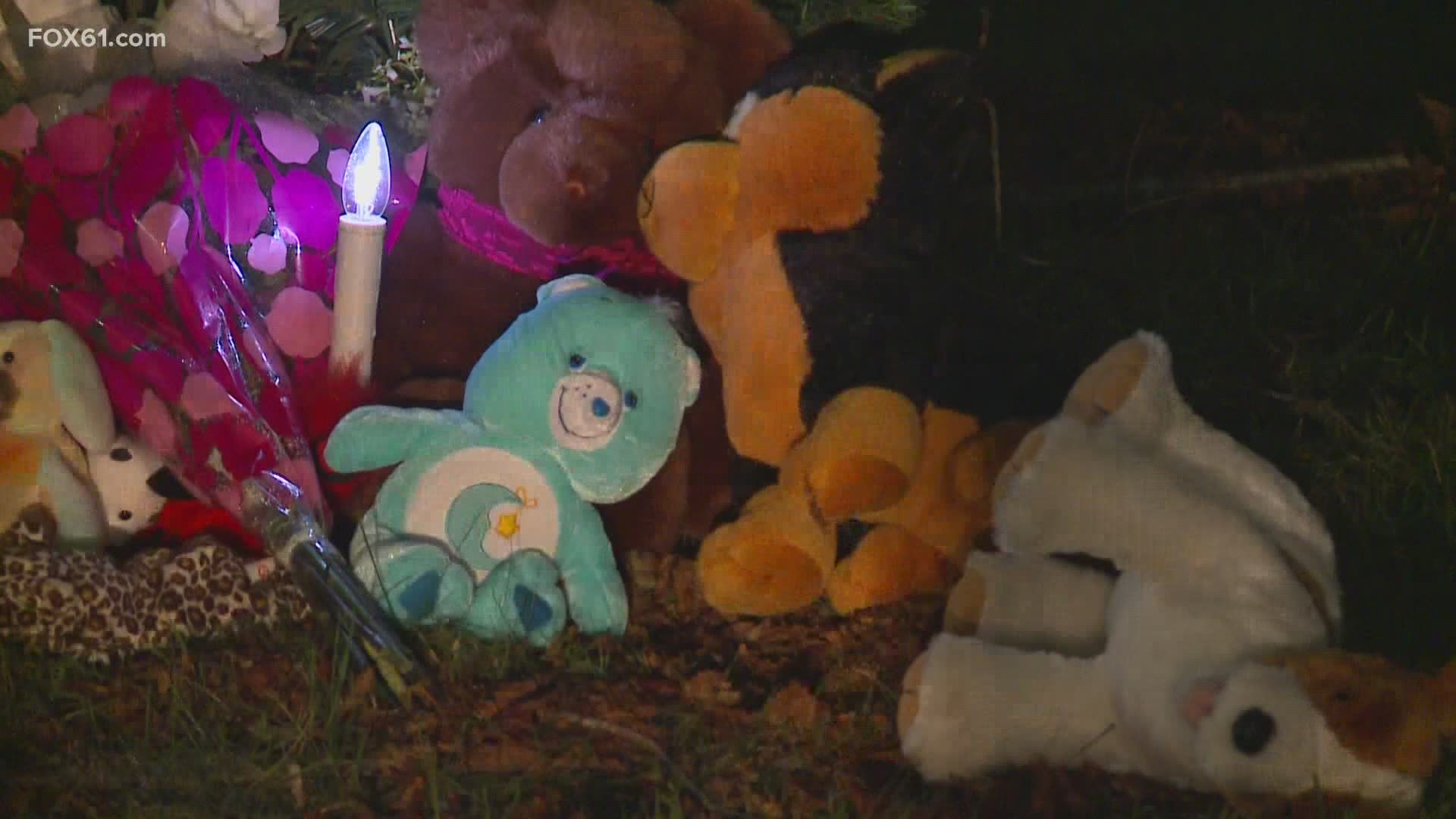 Many in the tight-knit community have visited a memorial on the town green that is draped in prayer ribbons and surrounded by candles and stuffed animals.
