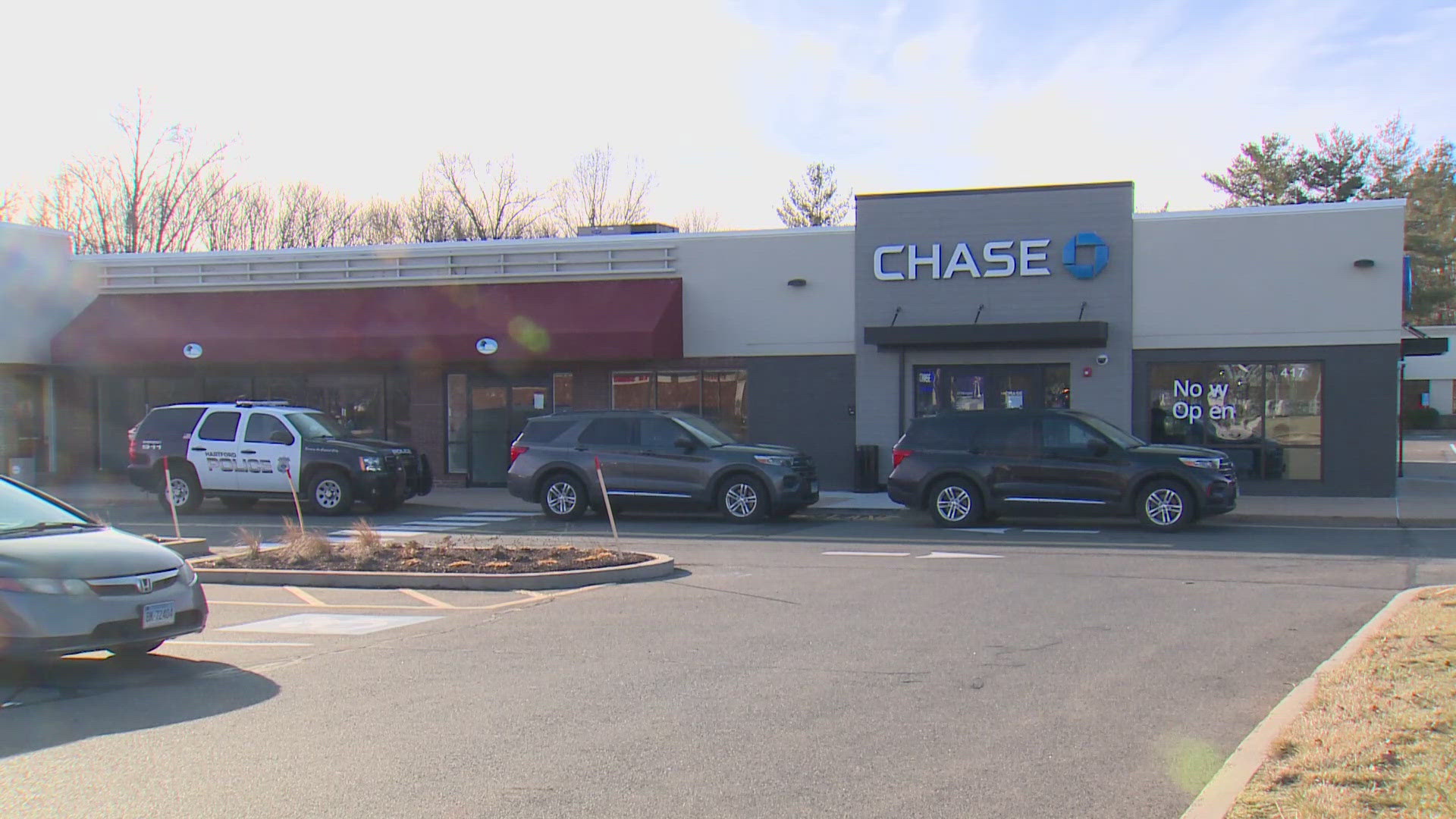 The bank robbery occurred around 11:30 a.m. Friday. Police are searching for two suspects who fled the scene in a black Chevy Silverado pickup truck.