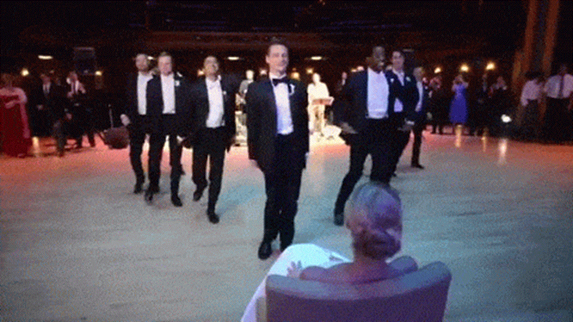 Groom, groomsmen surprise bride with epic 8minute dance routine