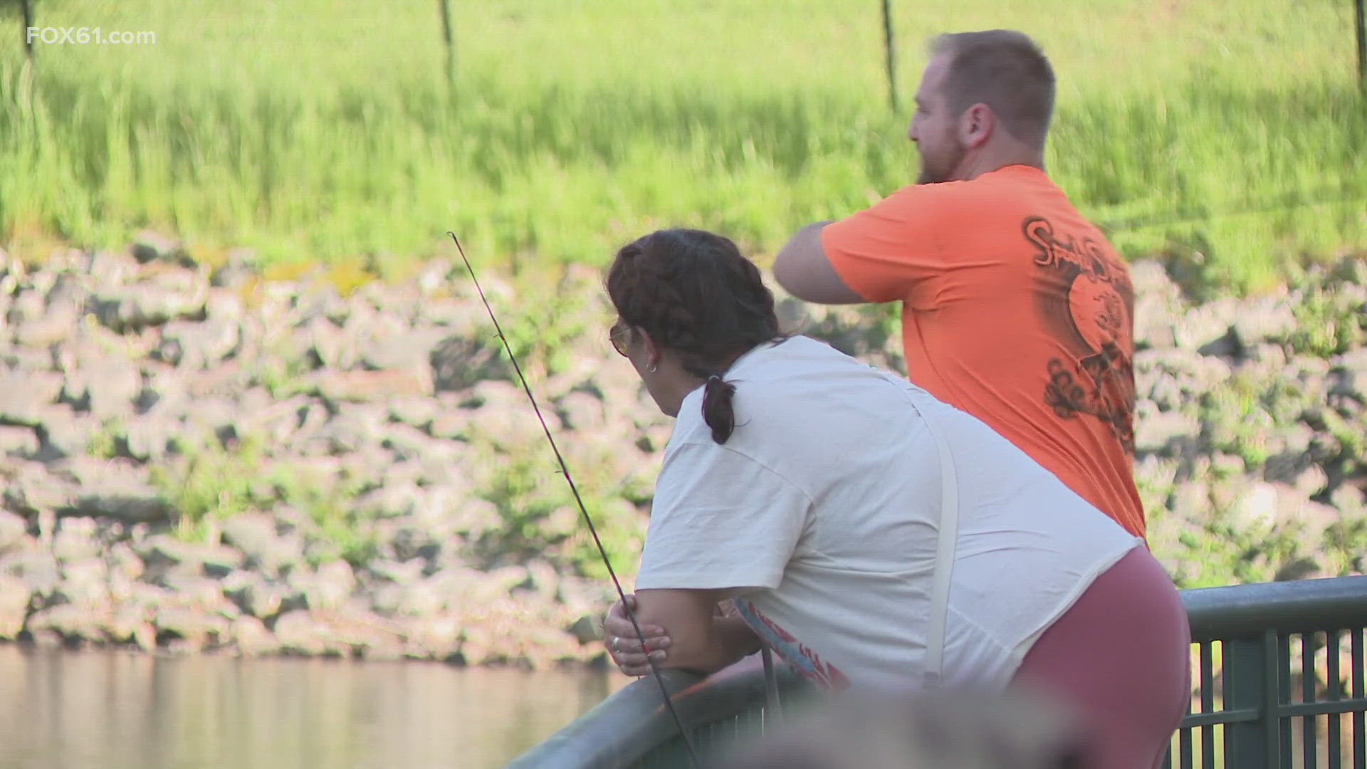 A free fishing event called "Fish with CARE" was held at Mohegan Park in Norwich Tuesday afternoon, offering people loaner rods, bait and fishing coaches.