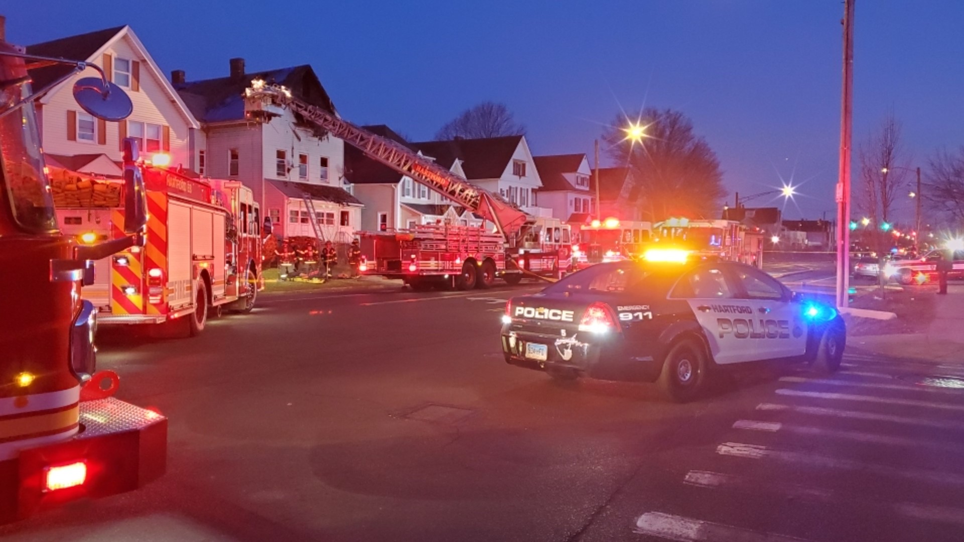 Firefighters battle house fire in Hartford