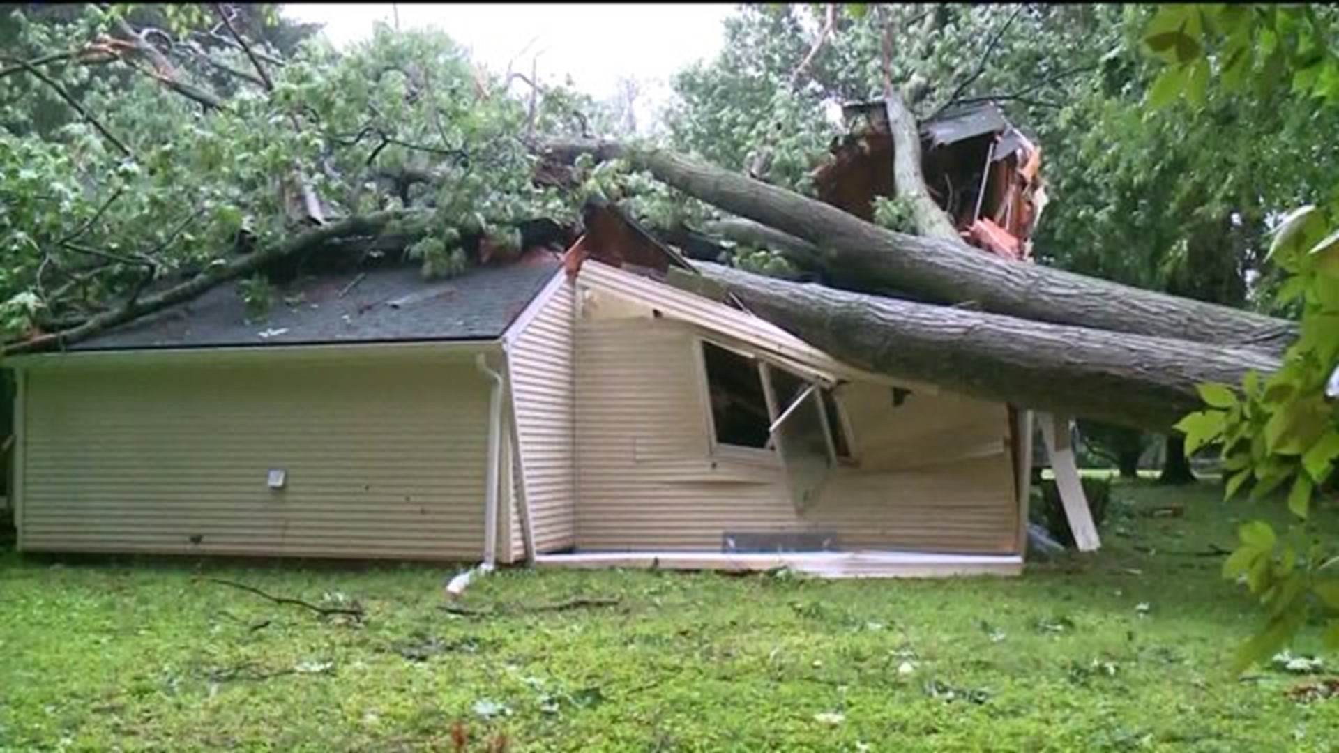 Families begin clean up after strong storms destroy neighborhoods
