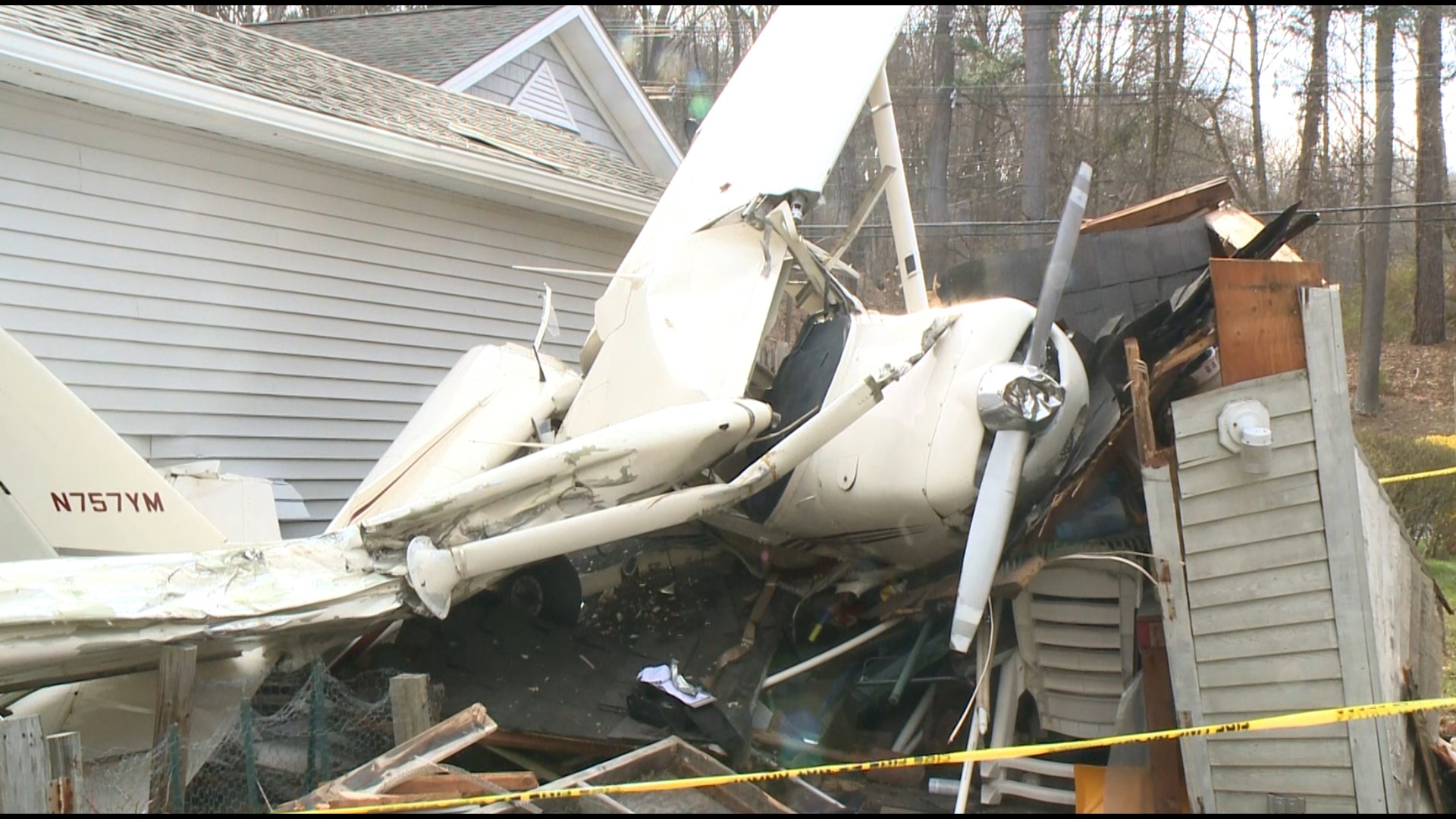 In the middle of a Danbury neighborhood sits houses, pools, and after Monday night, a small plane wreckage in a backyard.