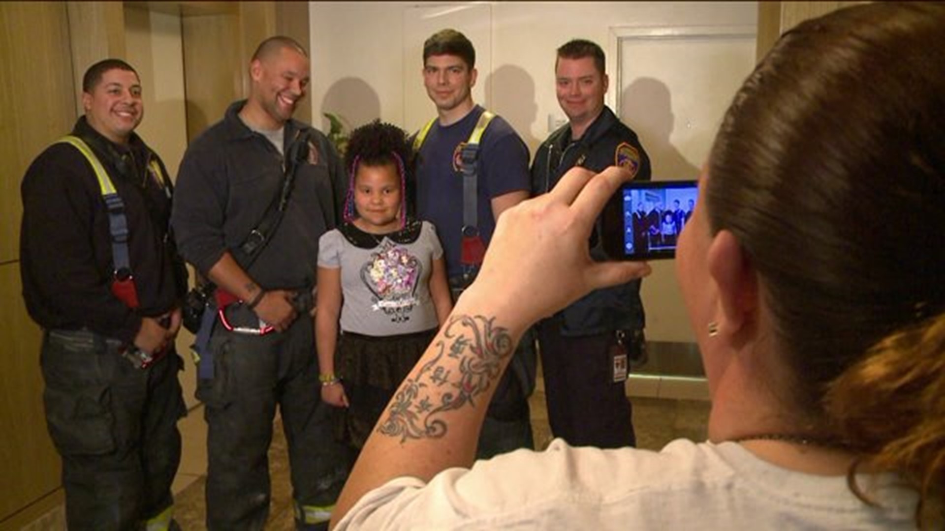 Girl meets firefighters who saved her