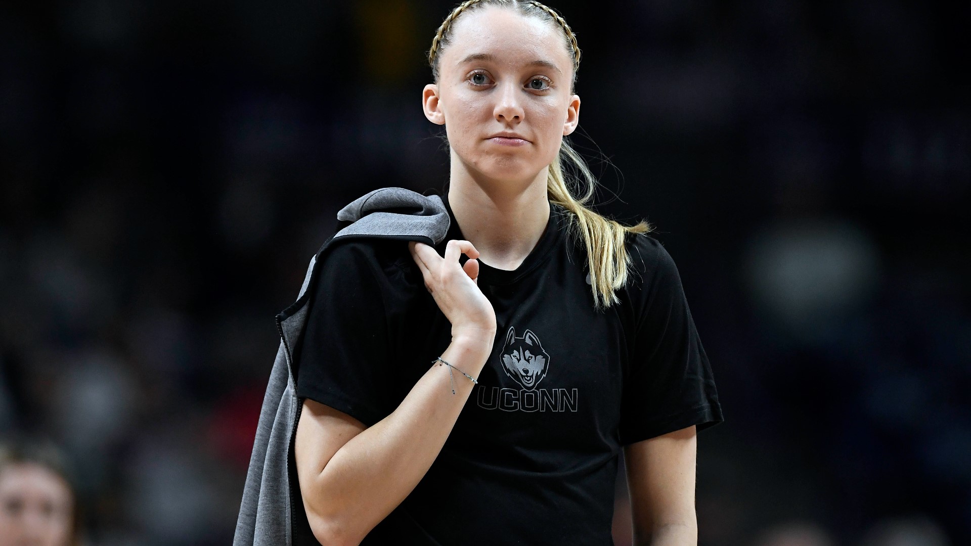 UConn women's basketball star Paige Bueckers confirms she is cleared to return to the court after sitting out last season to recover from a torn ACL.
