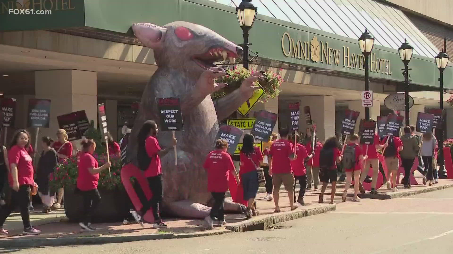 The hotel workers are on Day 2 of their strike, and their demonstration has gotten larger. Over 100 union workers and supporters are picketing in New Haven.