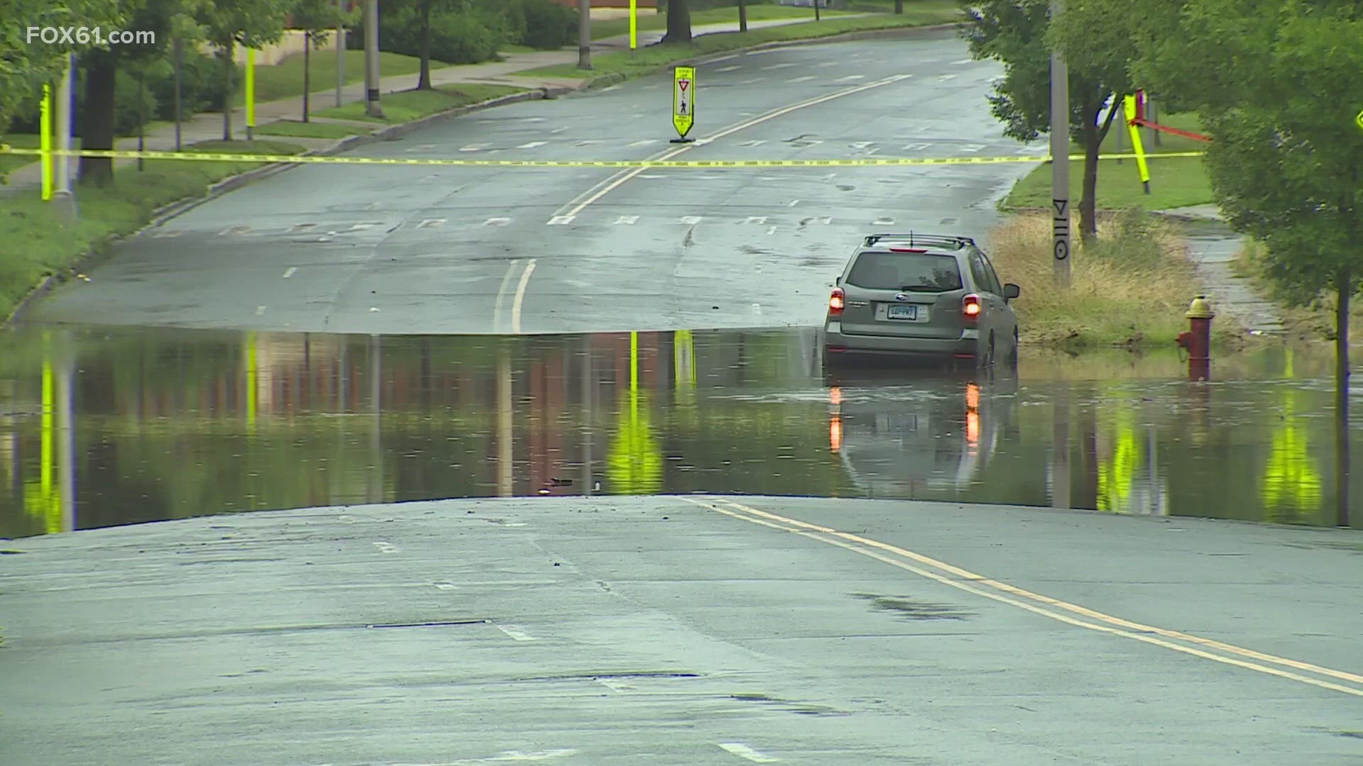 Heavy downpours lead to flash flooding, making West Hartford's roads and backyards look more like a lake.