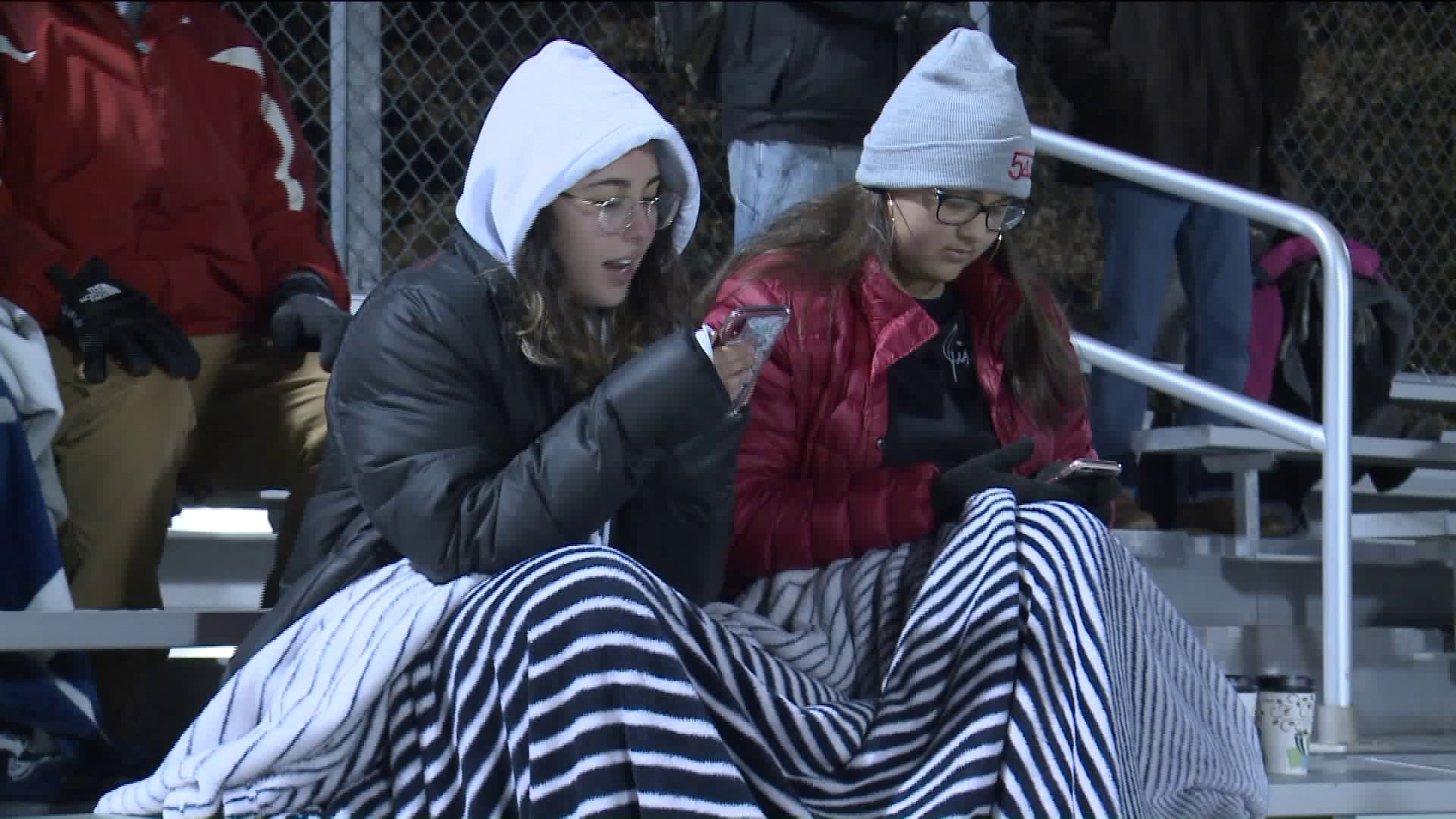 Fans brace cold, try to stay warm at Wethersfield girls soccer playoffs