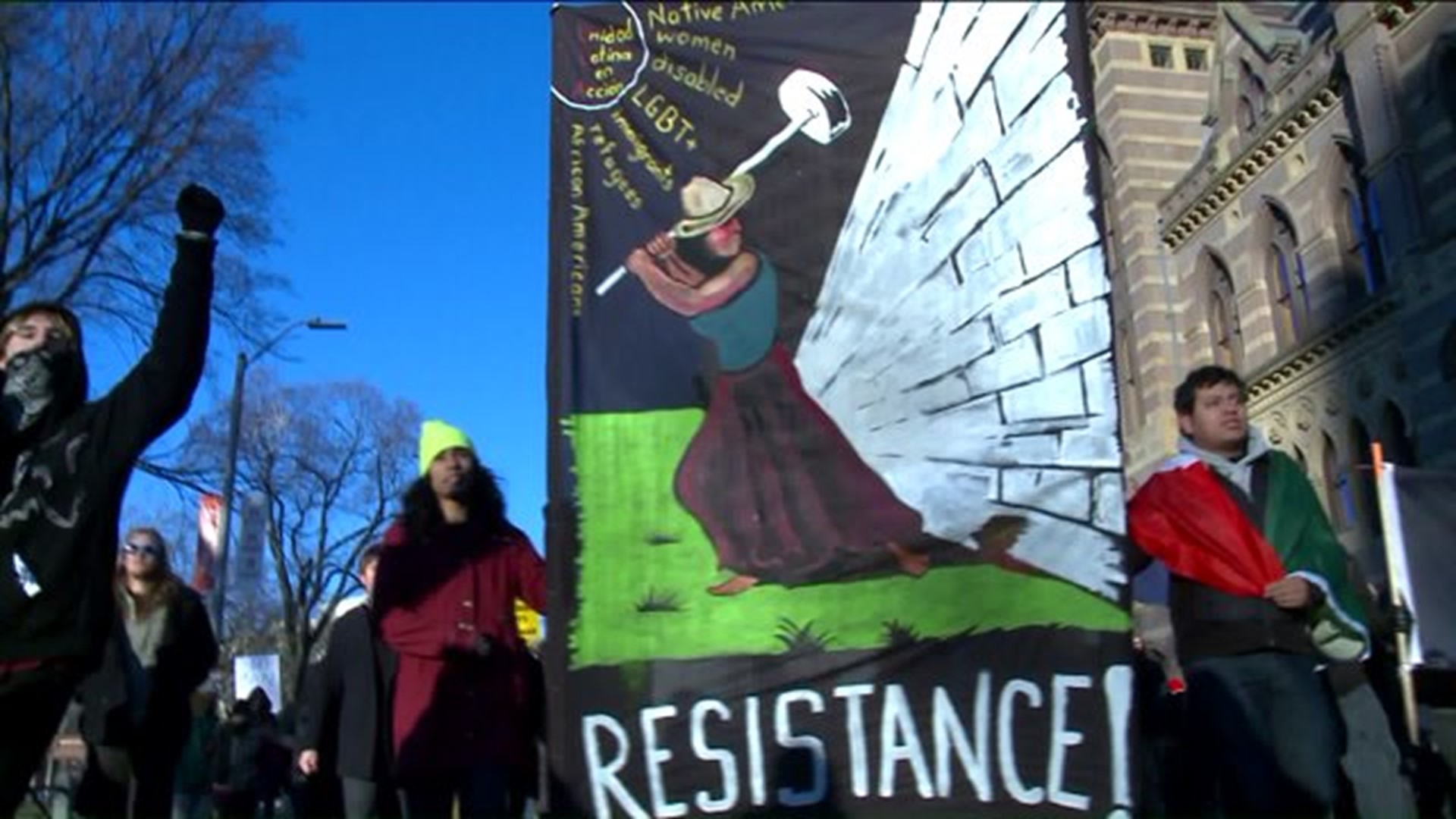 Dozens of protesters gather in New Haven to speak out against President Trump