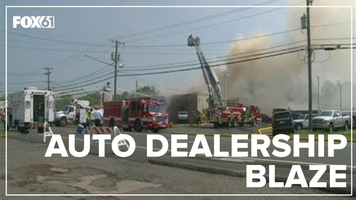Enfield auto dealership heavily damaged in fire; 2 people injured