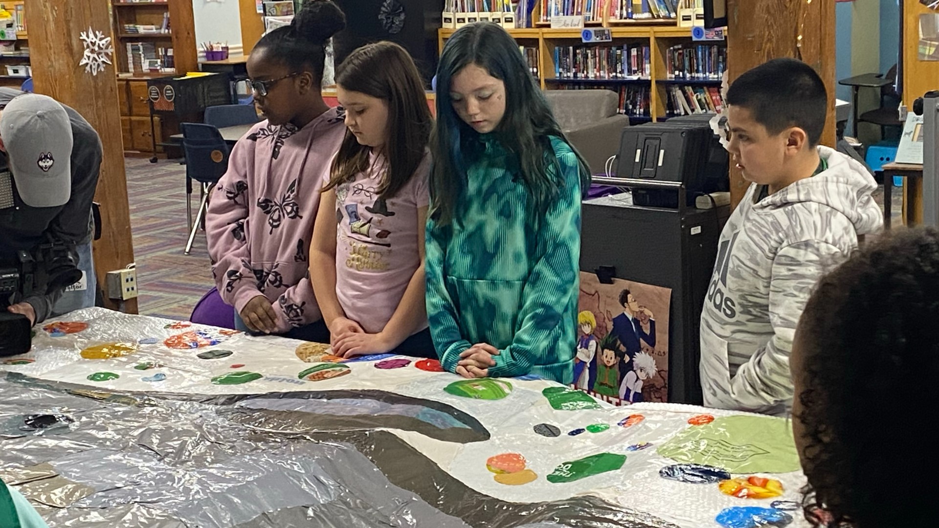 The third and fourth-grade students at the Integrated Day Charter School in Norwich have had their hands full as they work on an art project meant to send a message.