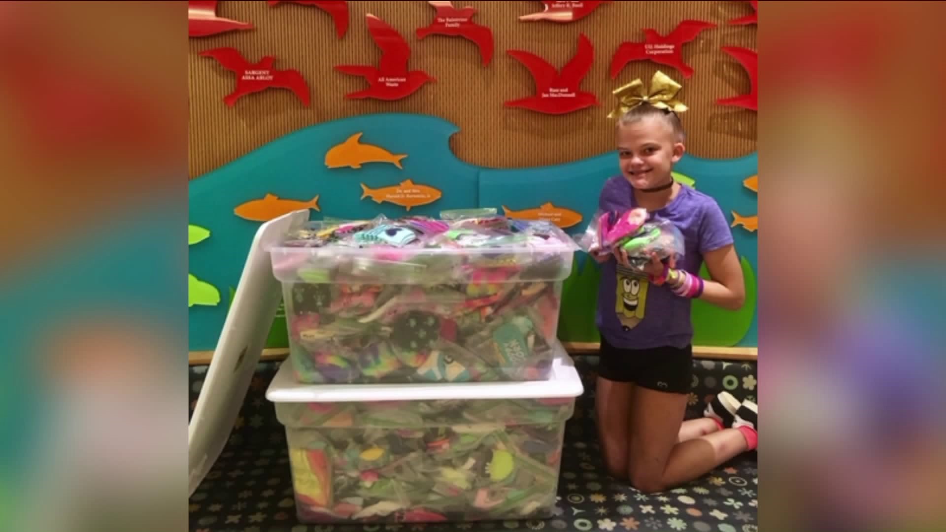 Young girl collects socks for patients