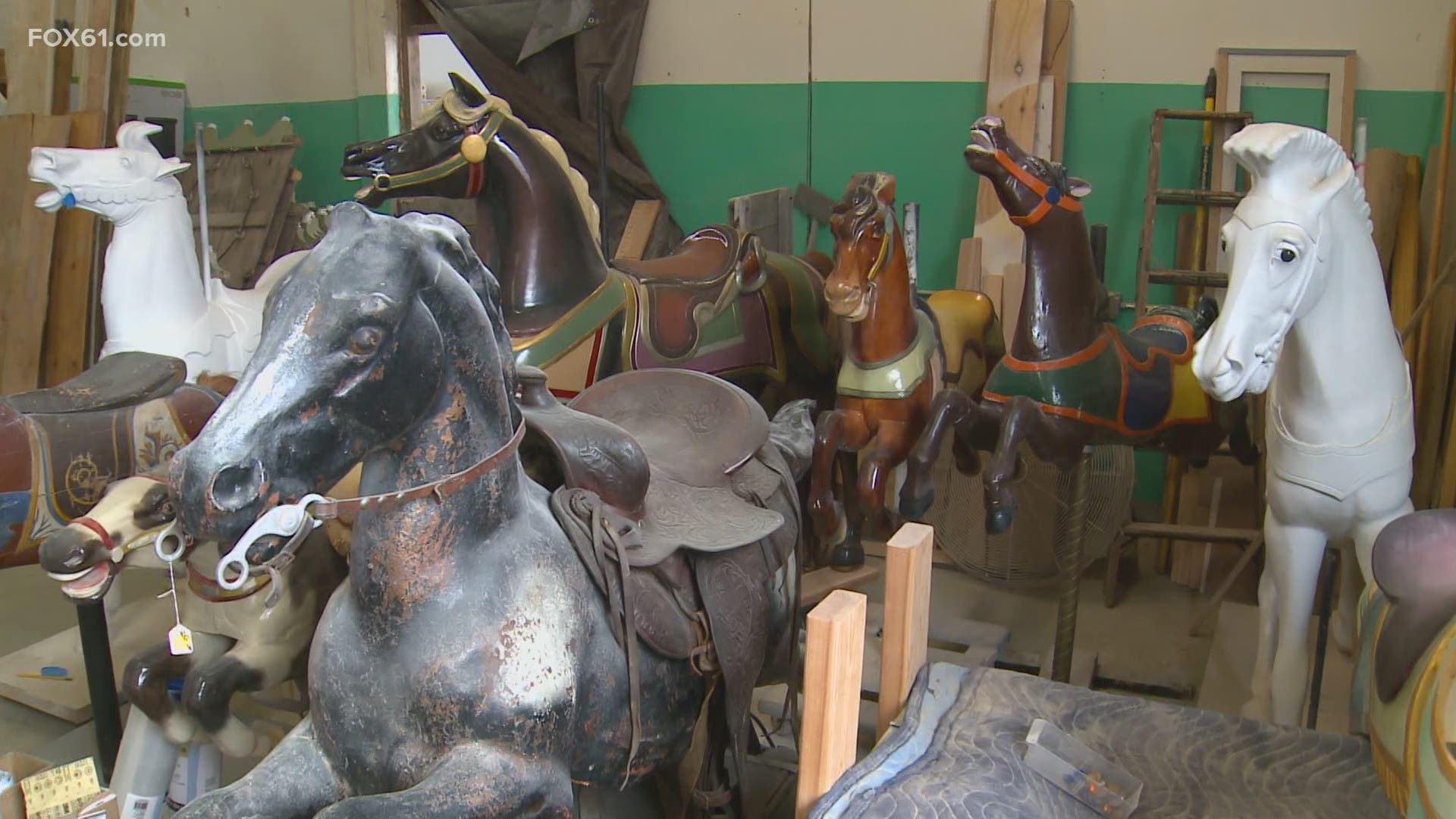 Team of artists and craftsmen get work from around the country, building new pieces and also restoring carousel horses