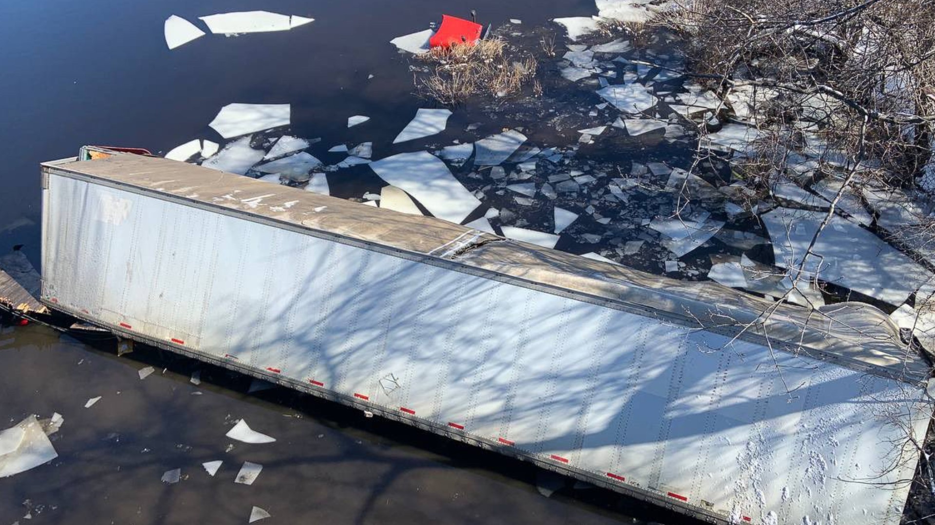 Video, captured by the State Police Association of Massachusetts, shows the tractor-trailer carrying mail leaving the roadway and falling into the river.