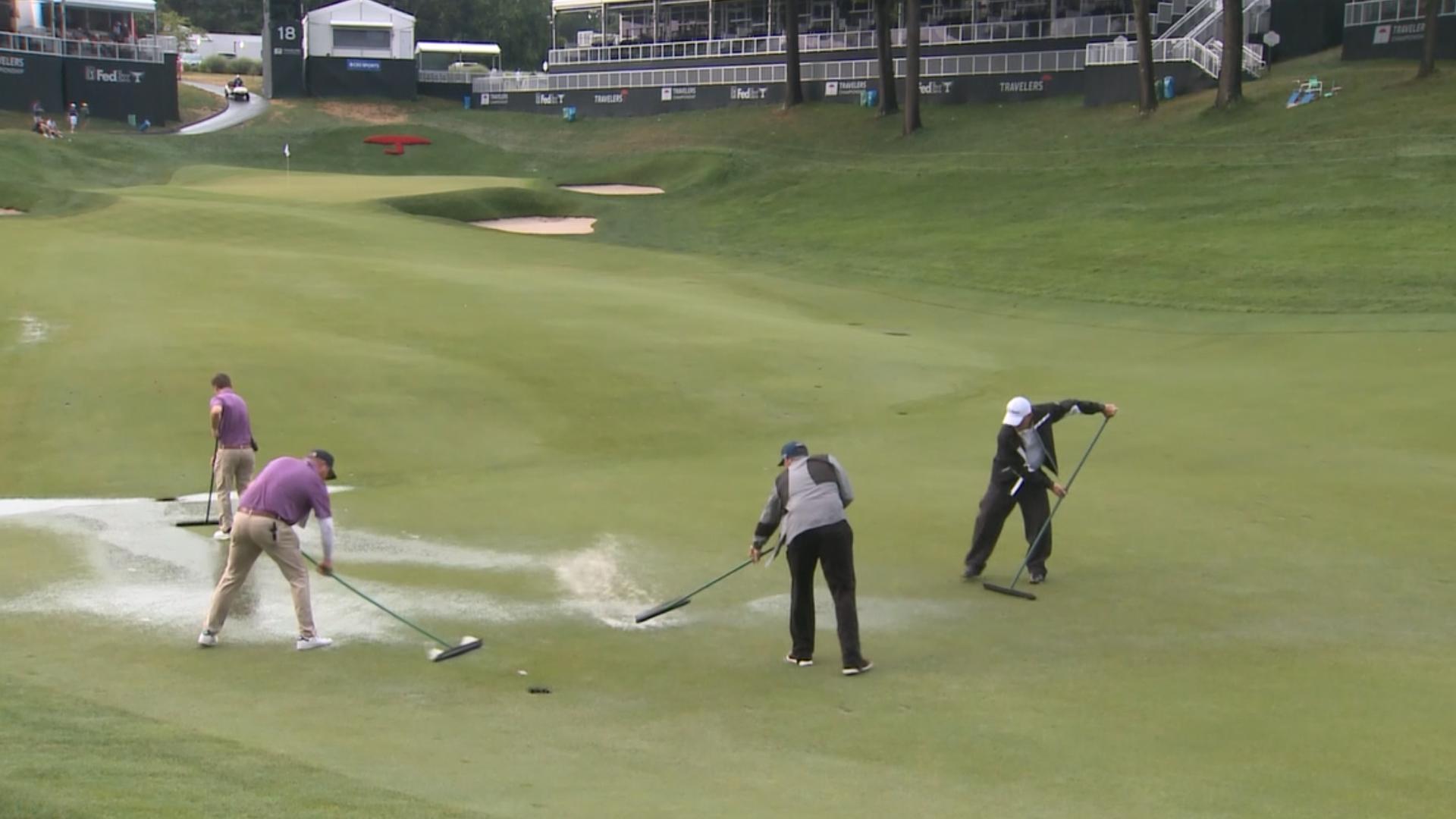 Watch the grounds crew prepare Hole 18 at the Travelers Championship after a two-hour rain delay at TPC River Highlands on Saturday, June 22, 2024.