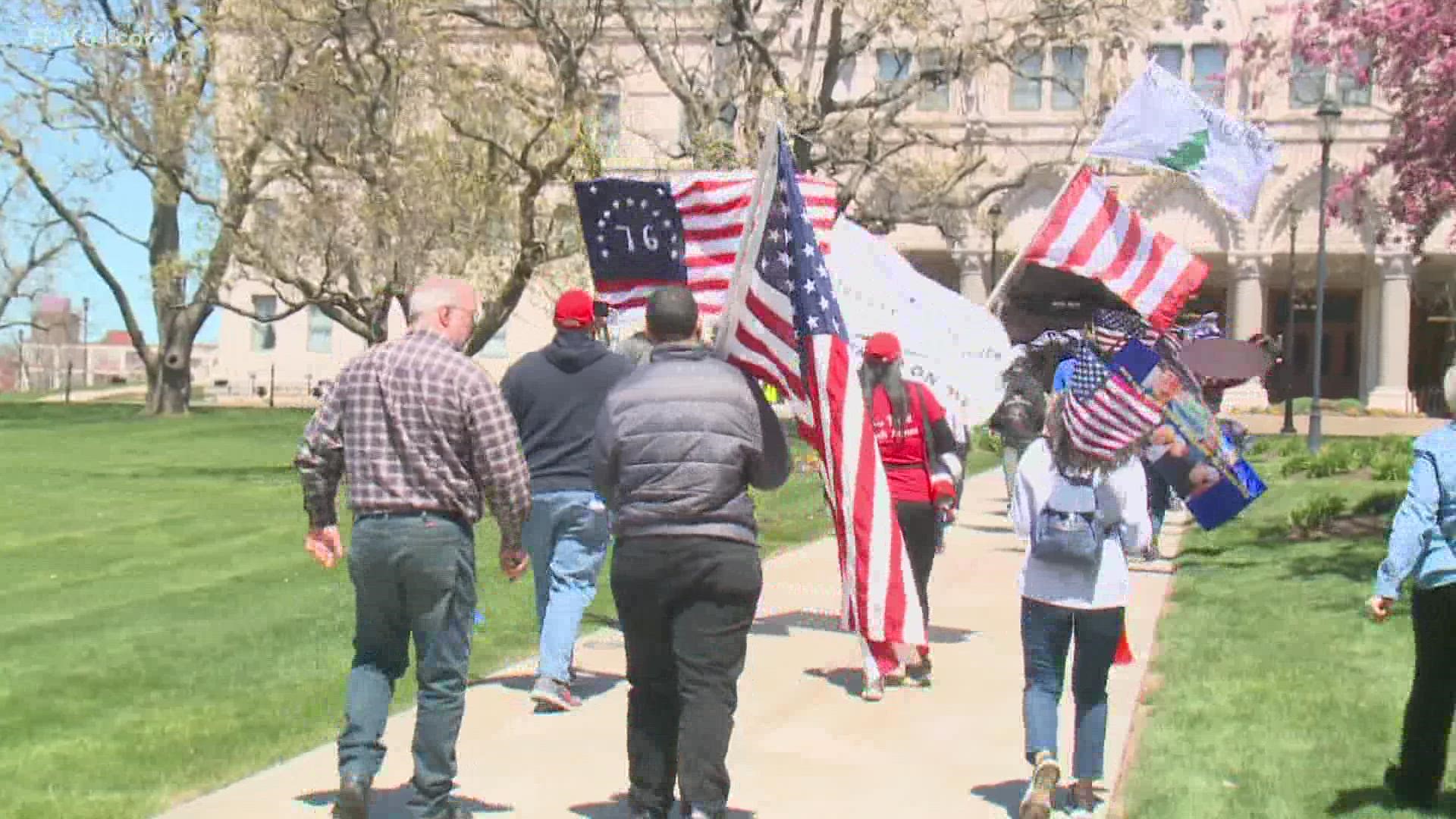 The two groups were not at the Capitol Saturday because of each other but agreed to let the rallies peacefully share their message.