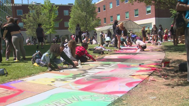 Hamden High students color courtyard in chalk