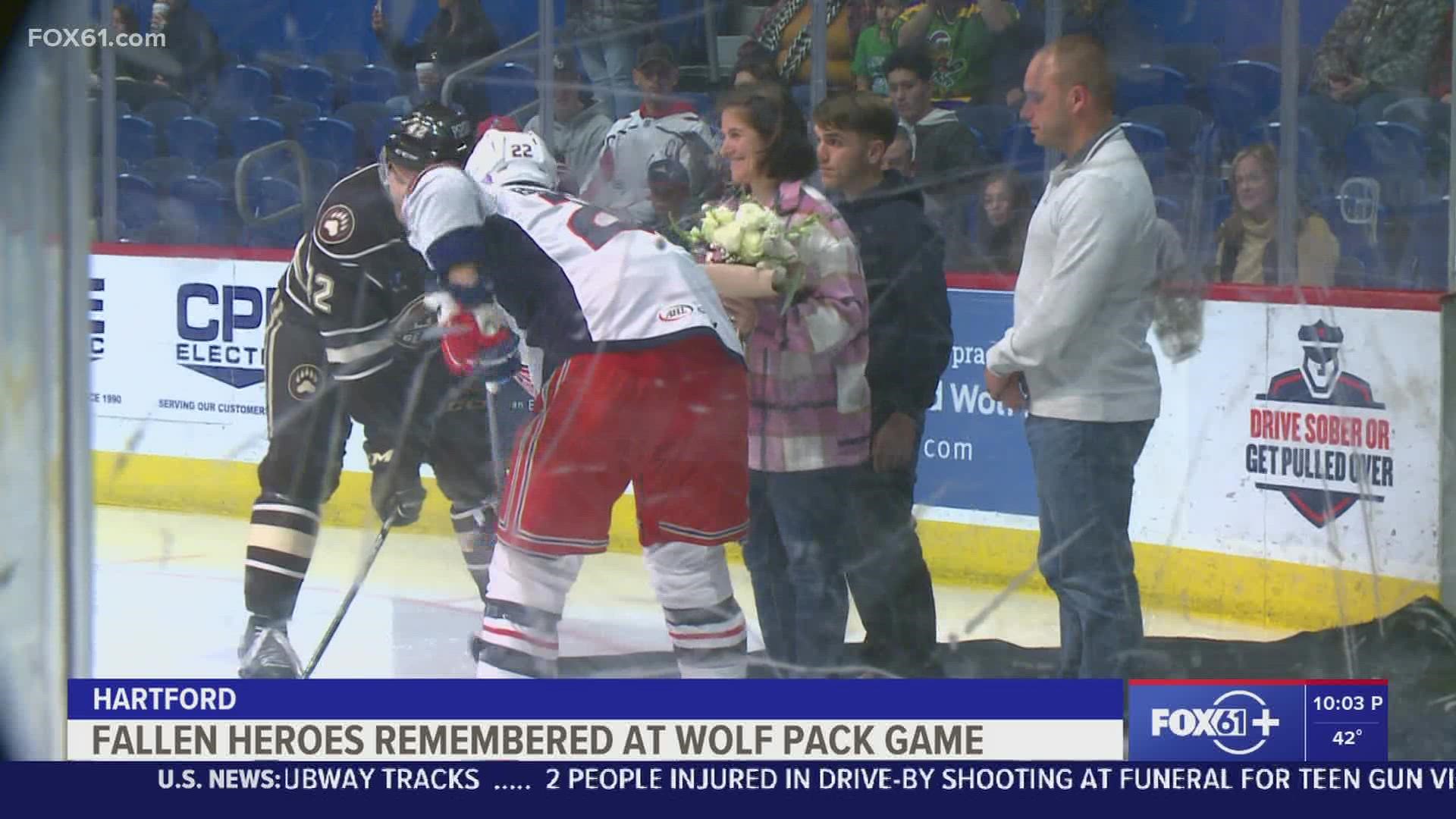 Laura DeMonte, the wife of Lt. Dustin Demonte, dropped the ceremonial puck before the game.