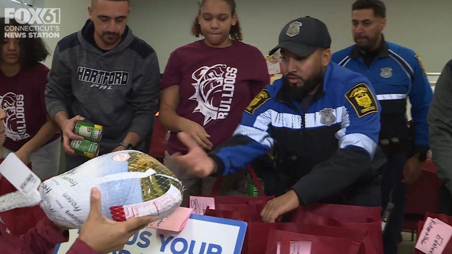 Hartford PAL was at Bulkeley High School to get ready to distribute frozen turkeys for Thanksgiving.