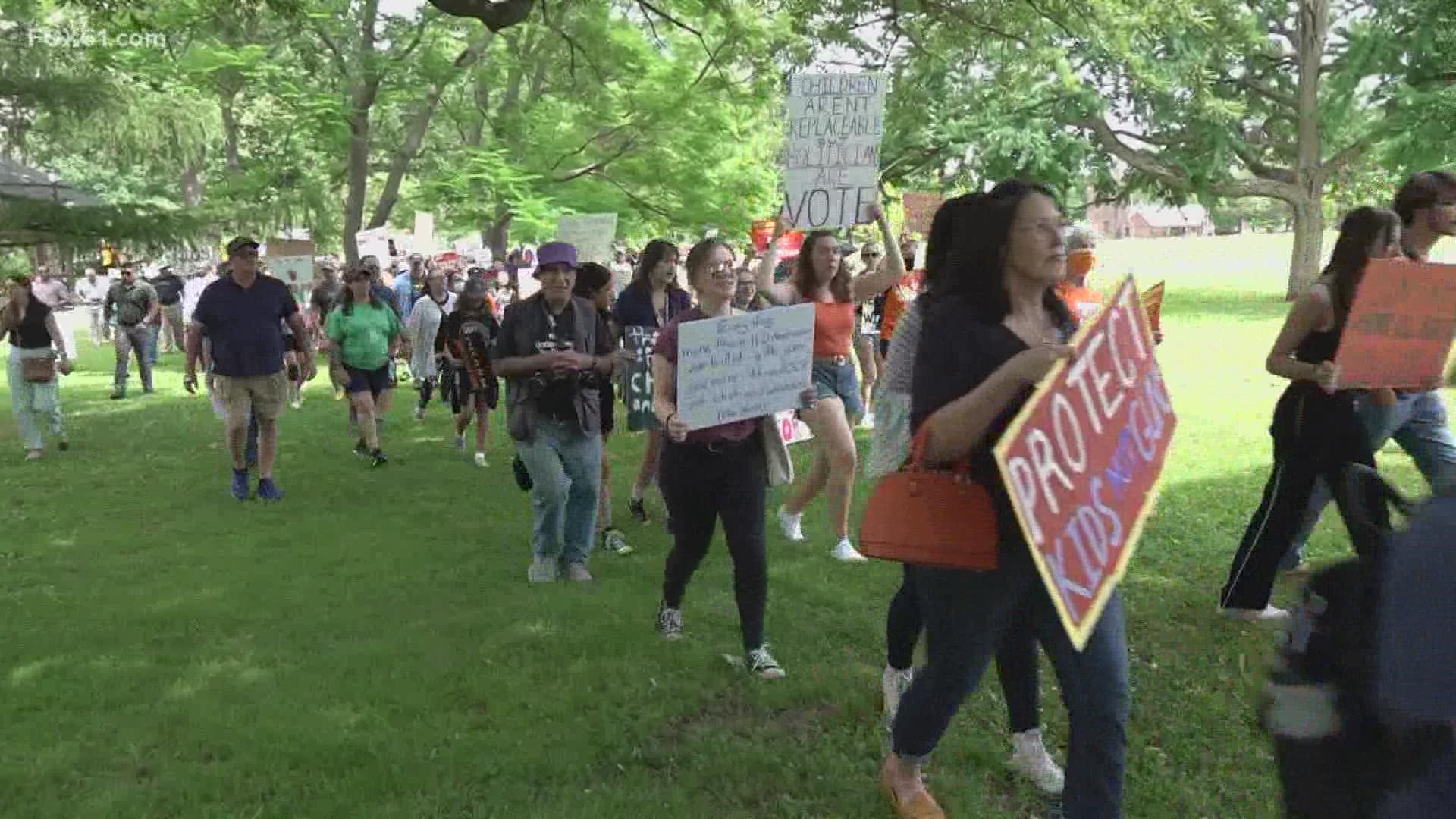 Hundreds marched from Bushnell Park to the Capitol Saturday to call for nationwide gun reform after the Texas elementary school shooting.