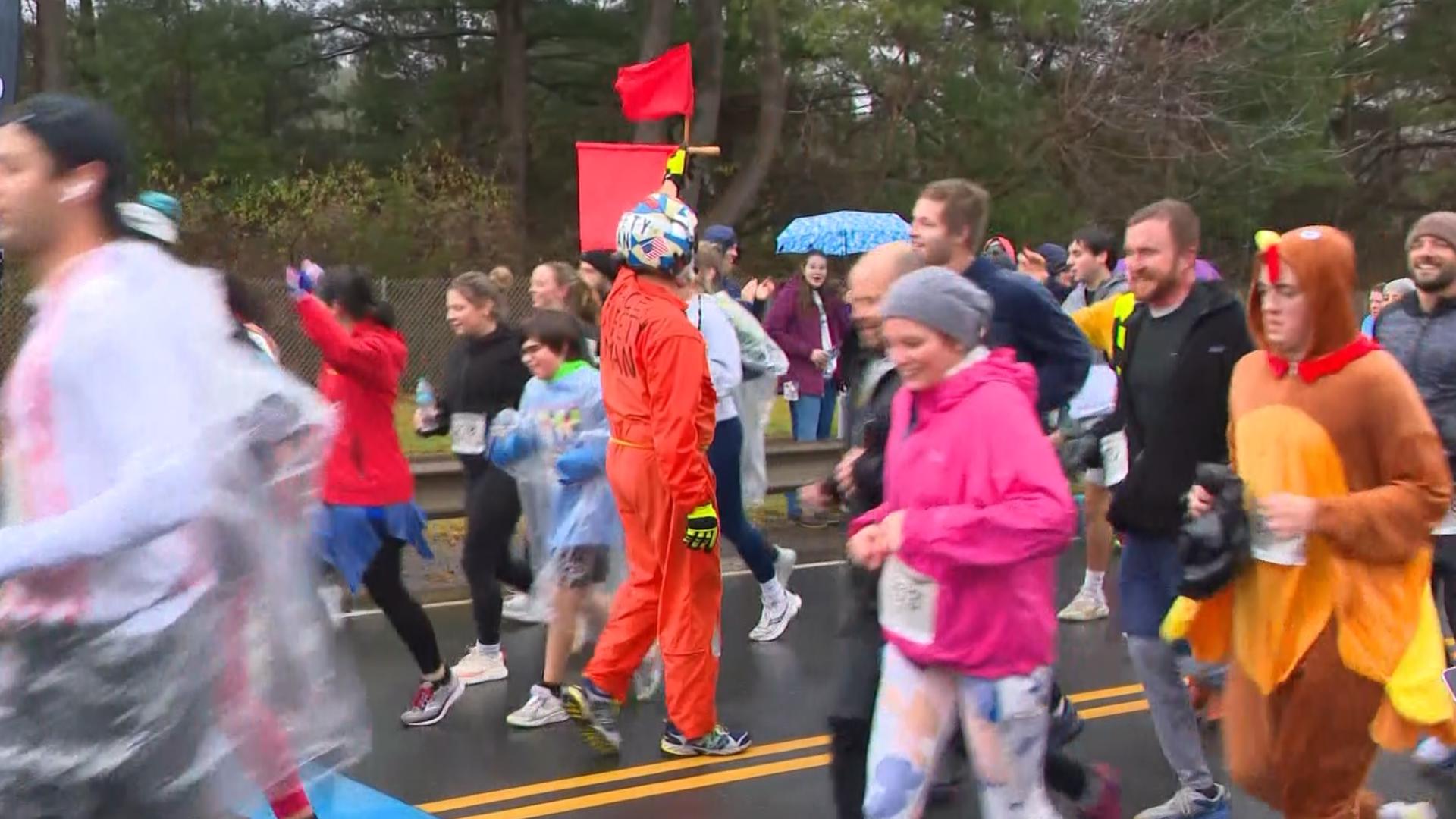 A wet road race didn't stop thousands of runners from hitting the pavement in Manchester Thursday.