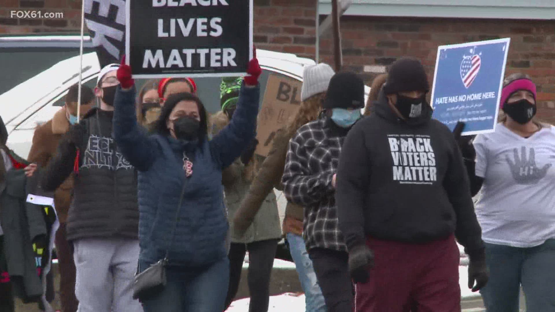 Members of the Naugatuck community participate in protest on town green after racist snapchat messages allegedly sent by the police chief’s daughter