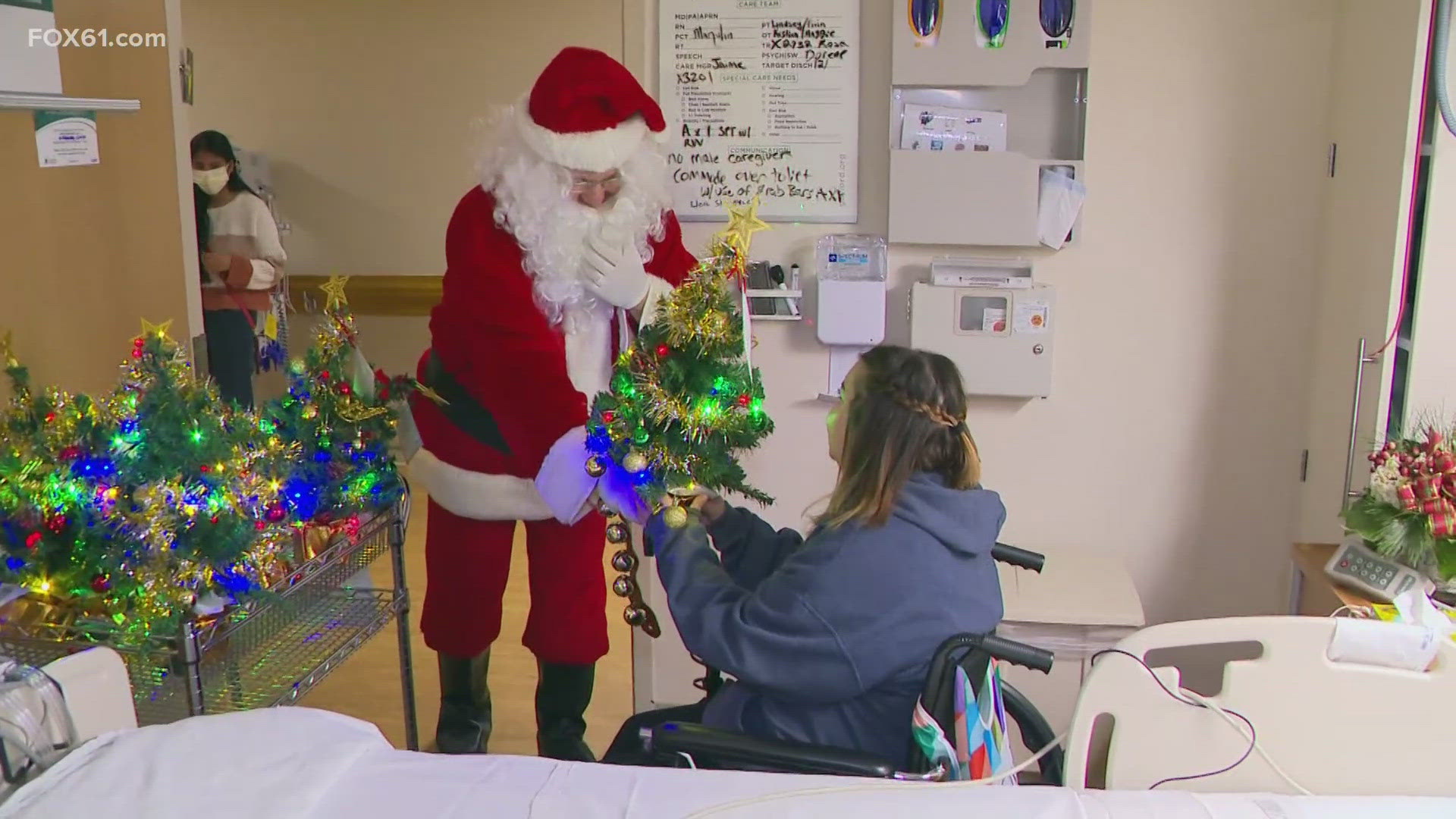 Gaylord Hospital treats patients who can't go home for the holidays with trees or menorahs.