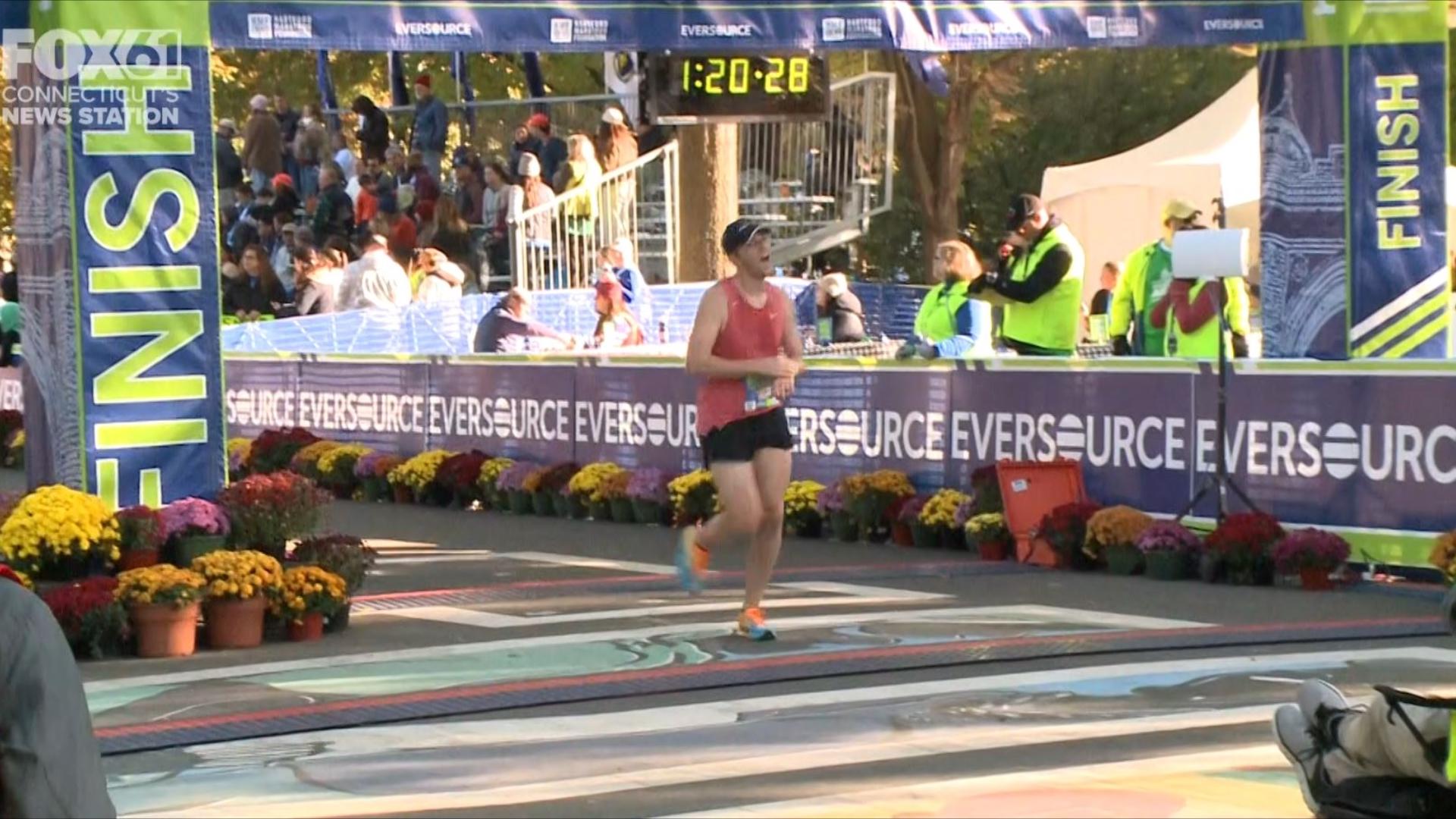 Runners celebrate completing road races at Eversource Hartford Marathon