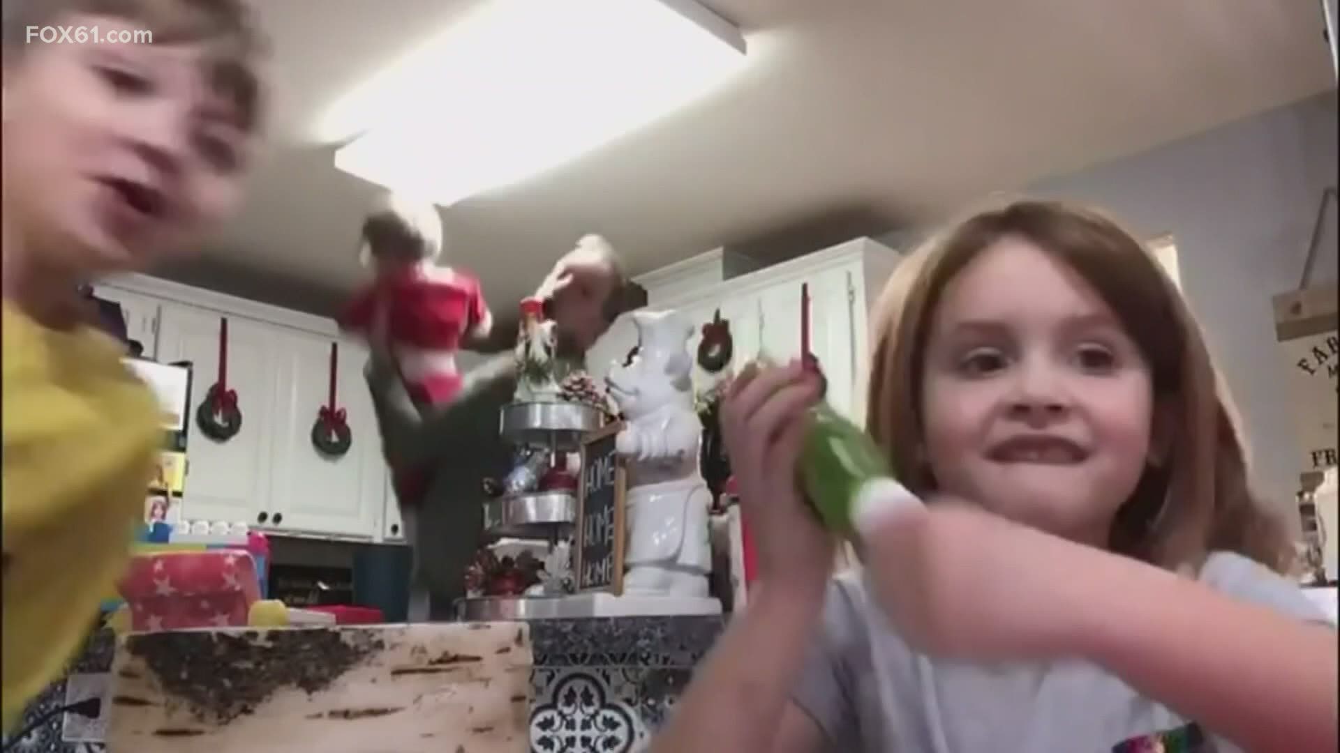 A young girl was filming a craft tutorial, but her dad and brother's crashed it in the best possible way.