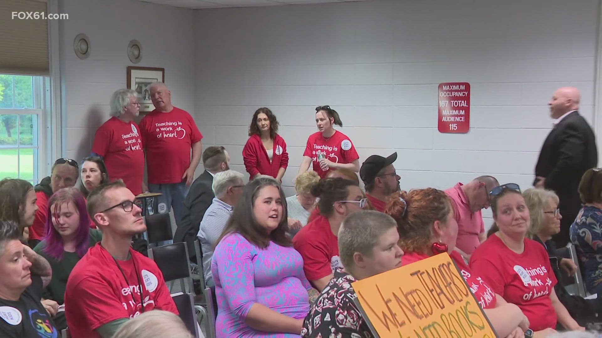 The town council voted 7-4 to pass an education budget that did not include the increase the Board of Education was hoping for, putting 121 jobs on the line.