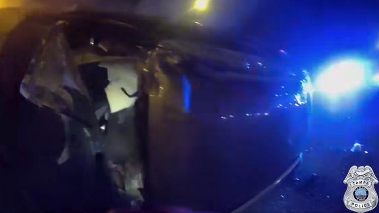 VIDEO: Tampa police rescue driver from car that flipped, caught on fire