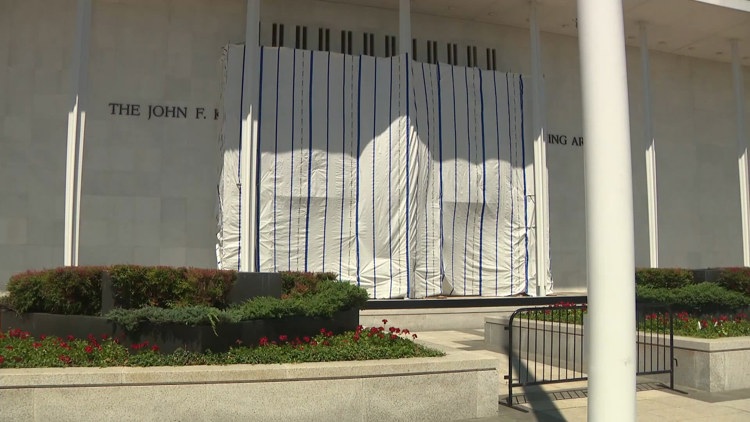 Why is a giant tarp still hanging at the Kennedy Center?