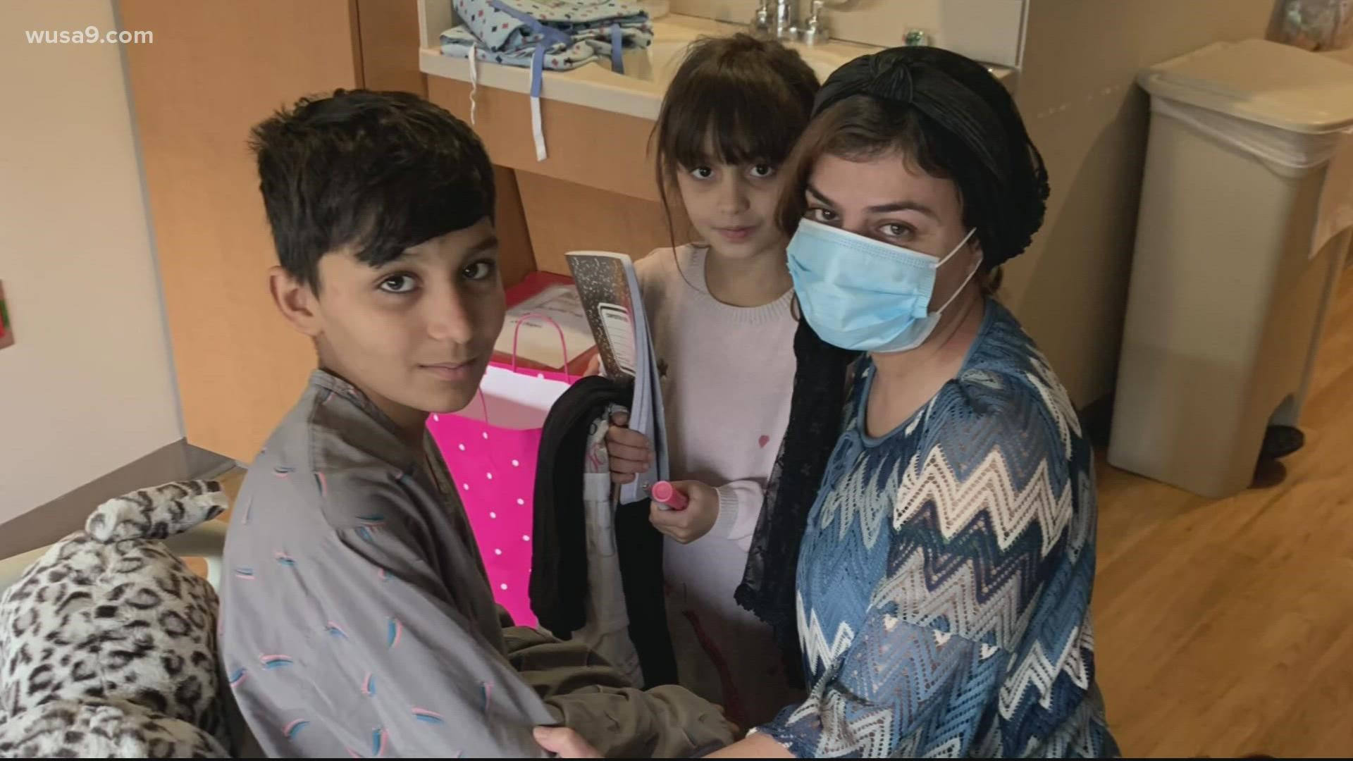 The children's mother was killed in the airport explosion that killed dozens of people in Kabul. Now they are reunited with family members on U.S. soil