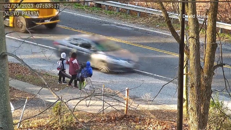 Driver speeds by school bus, almost hits Maryland mother and kids