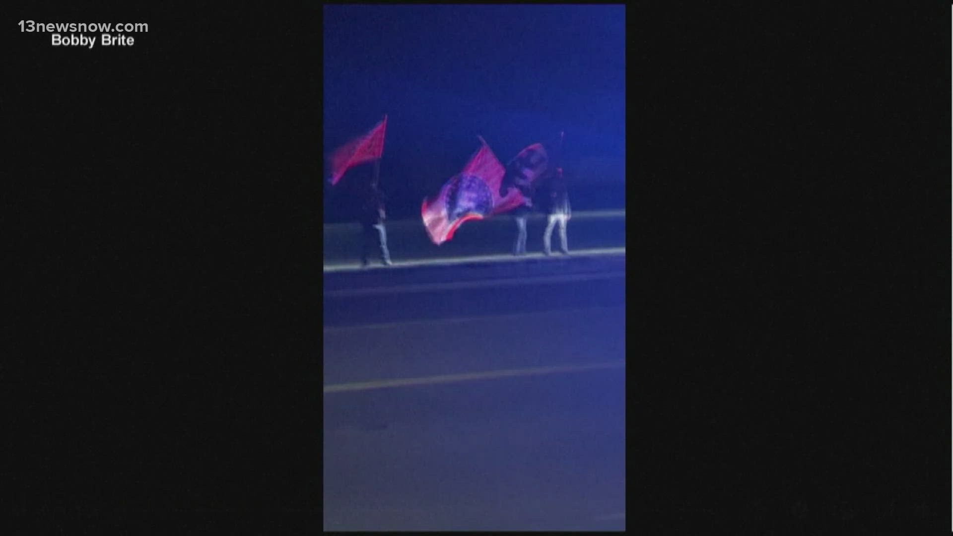 A group of masked demonstrators were seen waving Nazi flags outside a production of "The Diary of Anne Frank" in Howell, Michigan, on Saturday.