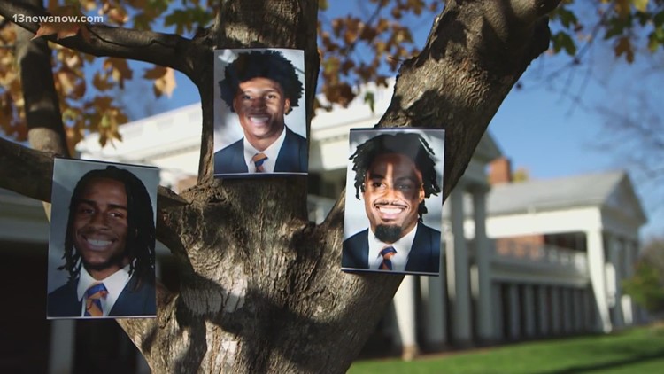 Flower memorials grow on the grounds of UVA, as students mourn killed football players