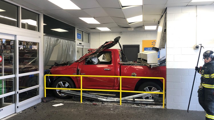 Driver, passenger, employee hospitalized after truck crashes into Suffolk Walmart