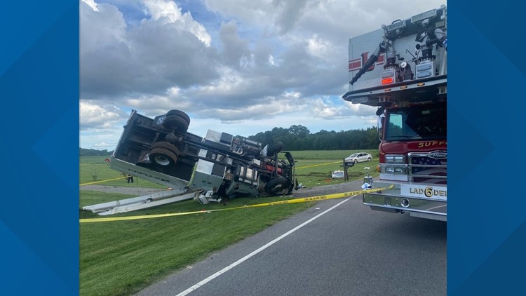 Tree trimming truck overturns in Suffolk