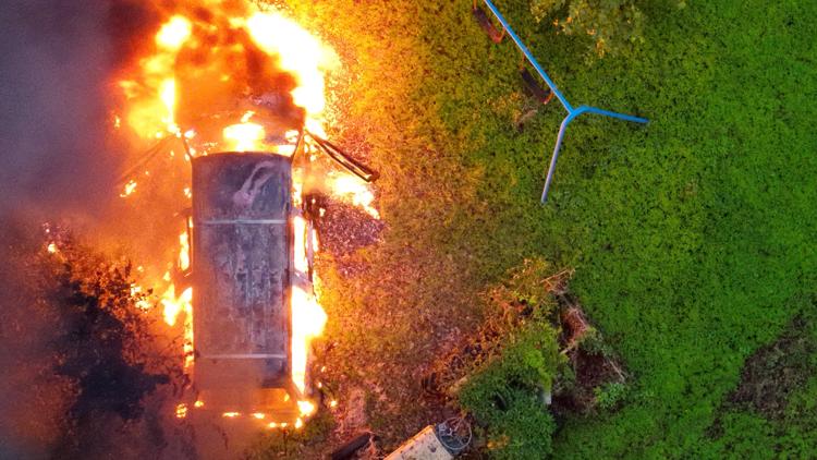 Investigation underway after vehicle fire in Virginia Beach backyard