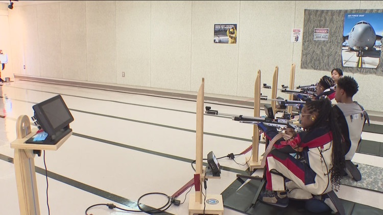 2 female high school seniors aim high as top shooters on Mays High School's rifle team