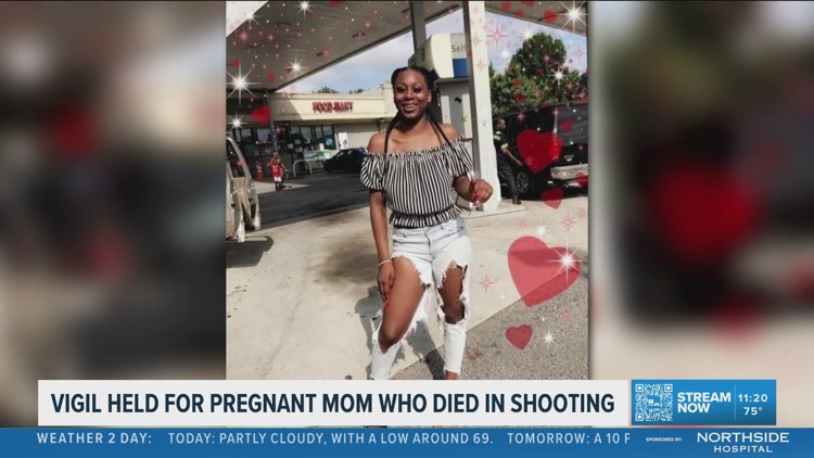 Family, friends gather for vigil for pregnant woman killed in own home