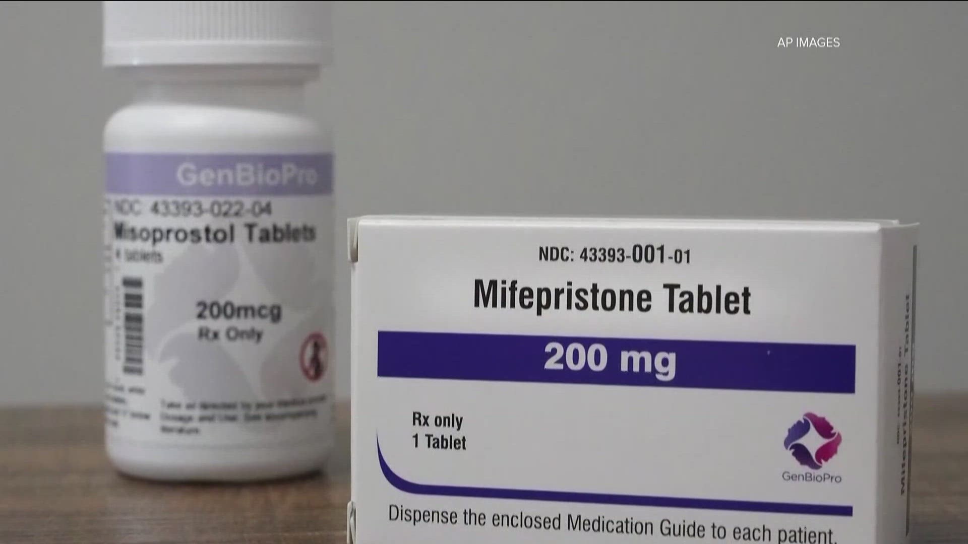 For now, the drug remains available in wake of the separate rulings that were issued just minutes apart by federal judges in Texas and Washington.