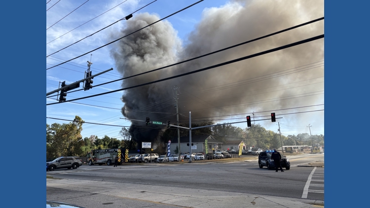 Firefighters in Clayton County contain large grass and debris fire
