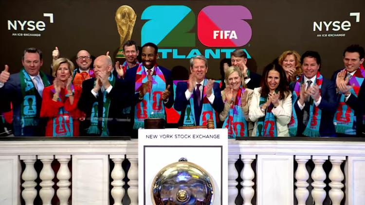 Atlanta contingent rings opening bell at New York Stock Exchange to mark approaching World Cup