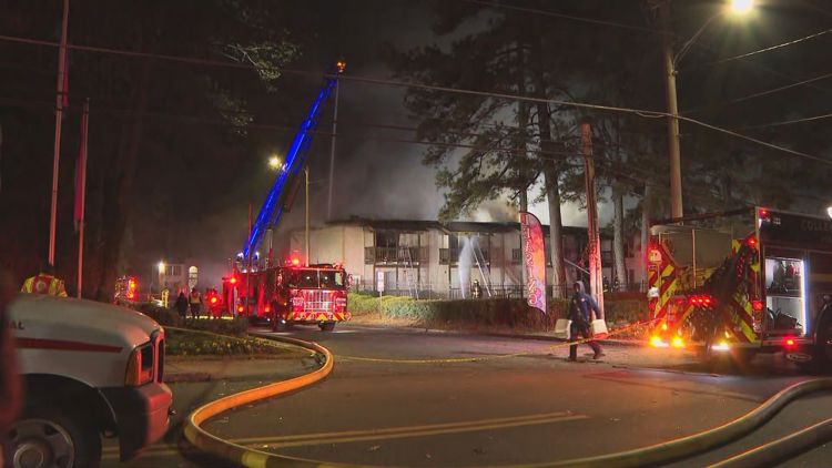 Firefighters work to put out flames at College Park apartment complex