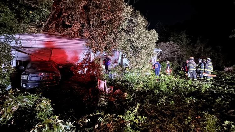 Fire crews in Cherokee County rescue resident after tree falls through home