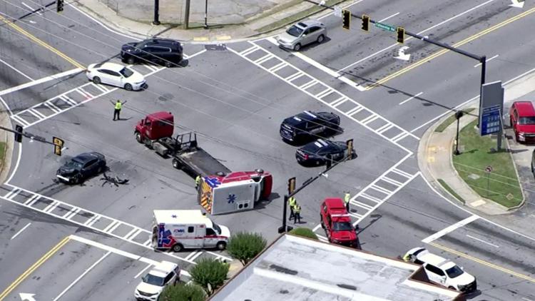 Ambulance overturns in DeKalb after crash; debris scattered in intersection