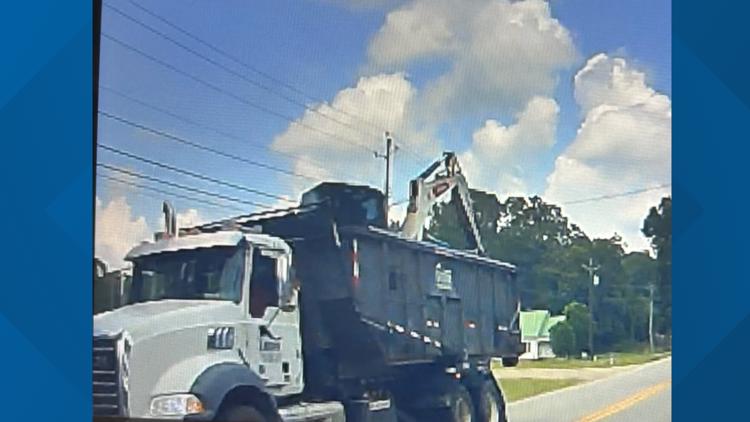 Explosion, grass fire and power outage in Social Circle caused by truck hauling excavator that hit power lines